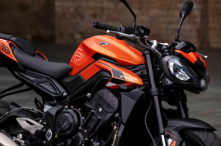 The Triumph Street Triple R is the mid-spec variant in the Street Triple range Triumph Street Triple R in orange front three quarter shot